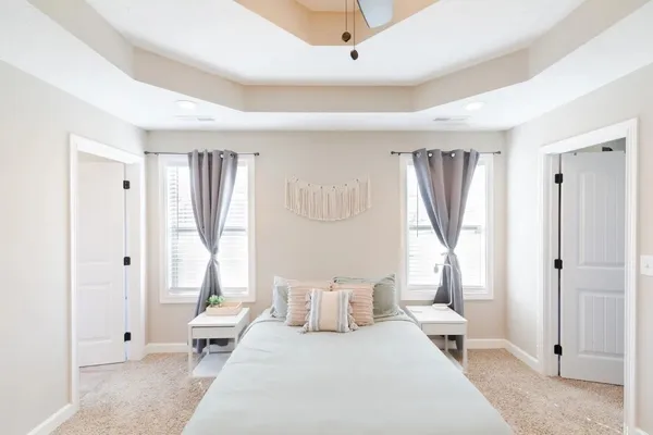 a bedroom with furniture and a window