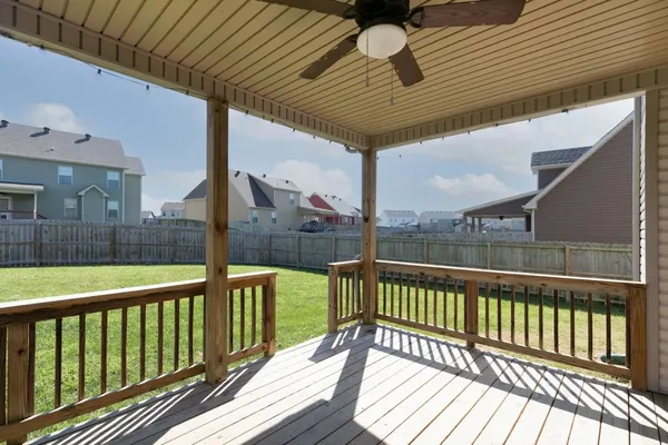 a view of a balcony with wooden floor