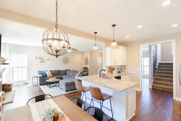 a very nice looking dining room with a table or chandelier