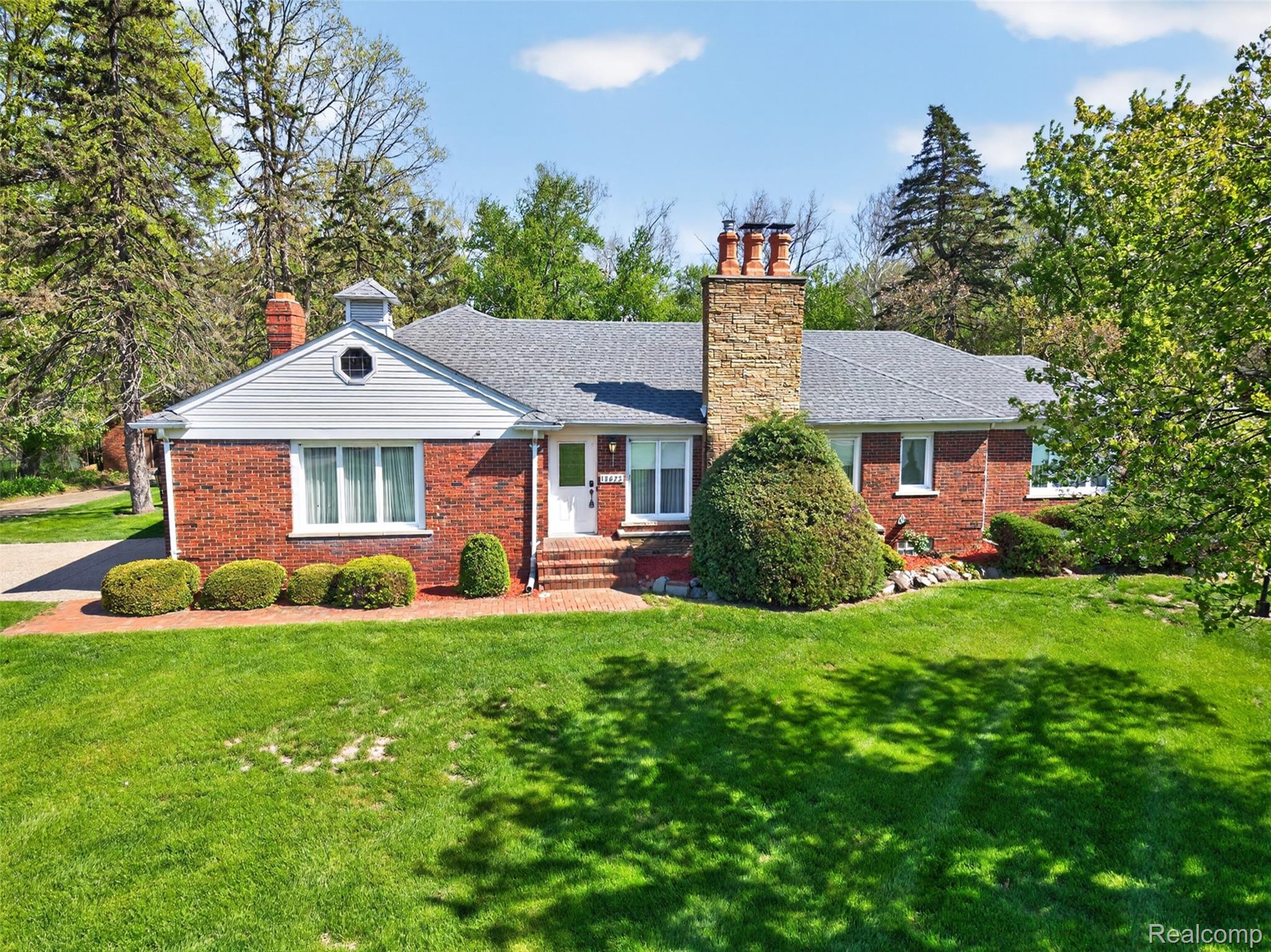 15623 Millar Road Clinton Township, MI 48036 - Photo 5 of 56 Ranch-style house with a chimney, a front yard, brick siding, and roof with shingles