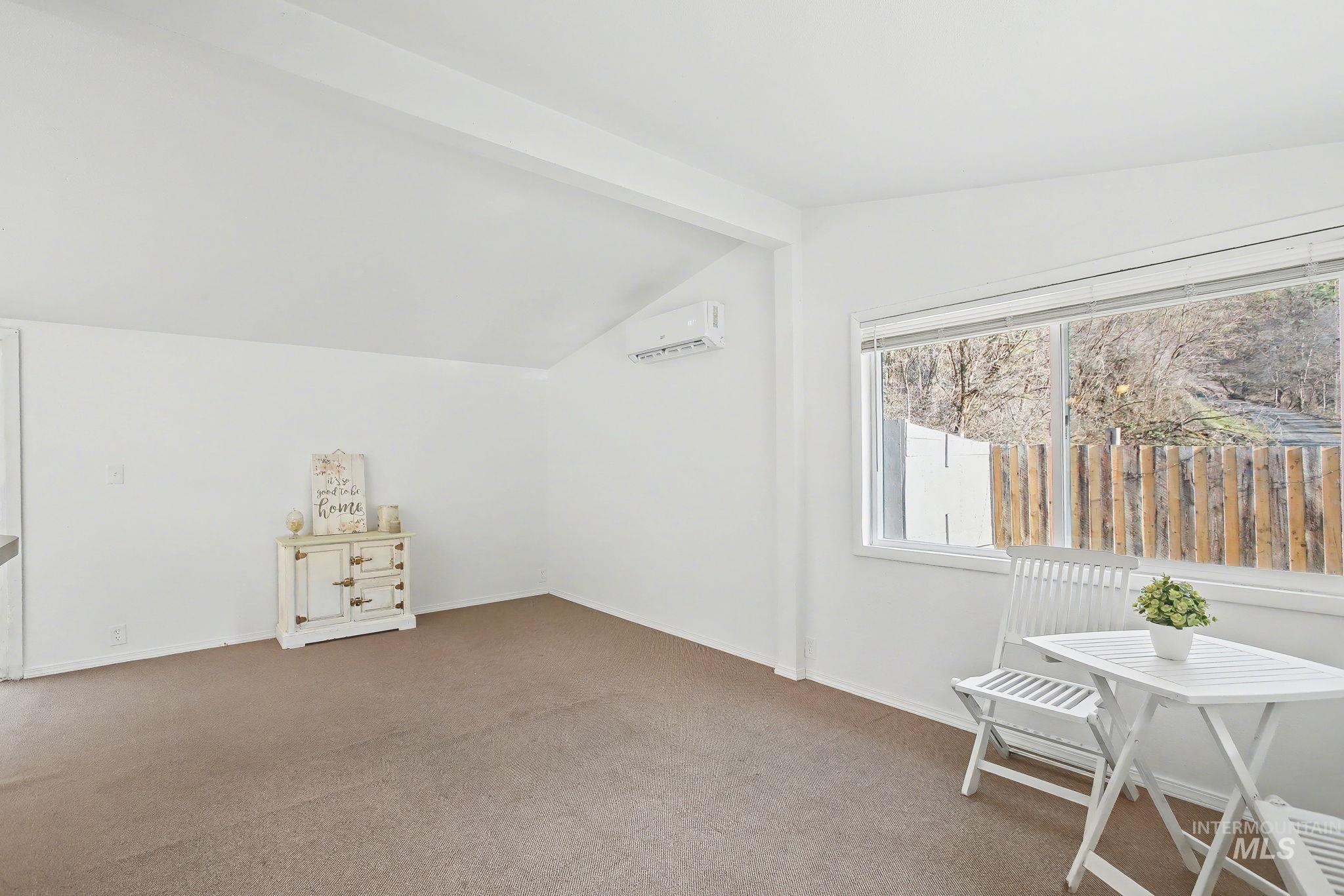 150 Elm Street Orofino, ID 83544 - Photo 4 of 36 Bonus room with carpet flooring and a wall mounted air conditioner