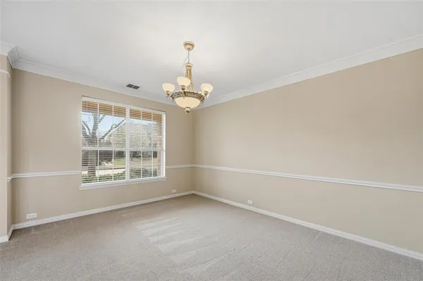an empty room with a empty space and windows