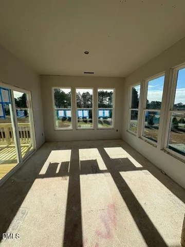 a view of an empty room with windows