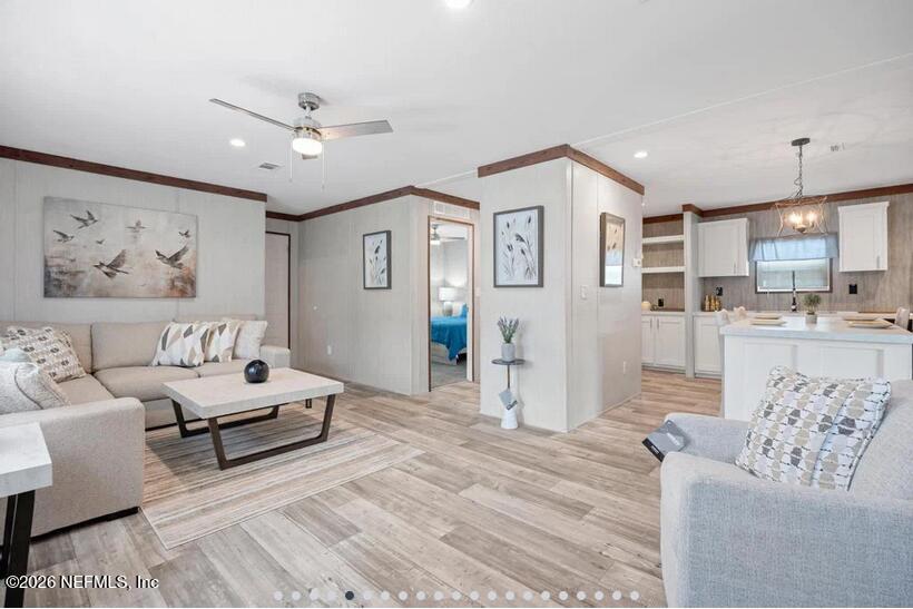 140 Islander Road Satsuma, FL 32189 - Photo 2 of 11 a living room with furniture and kitchen view