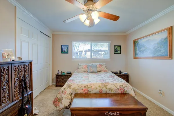 a bedroom with a bed and dresser