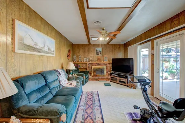 a view of a livingroom with furniture and a flat screen tv