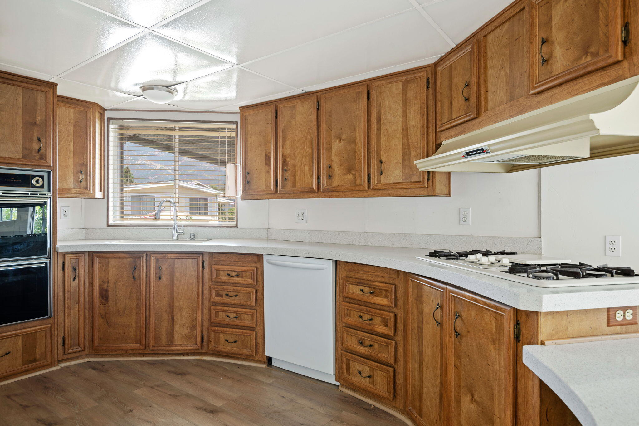 340 Old Mill Road, Unit 107 Santa Barbara, CA 93110 - Photo 12 of 33 a kitchen with cabinets appliances and a window