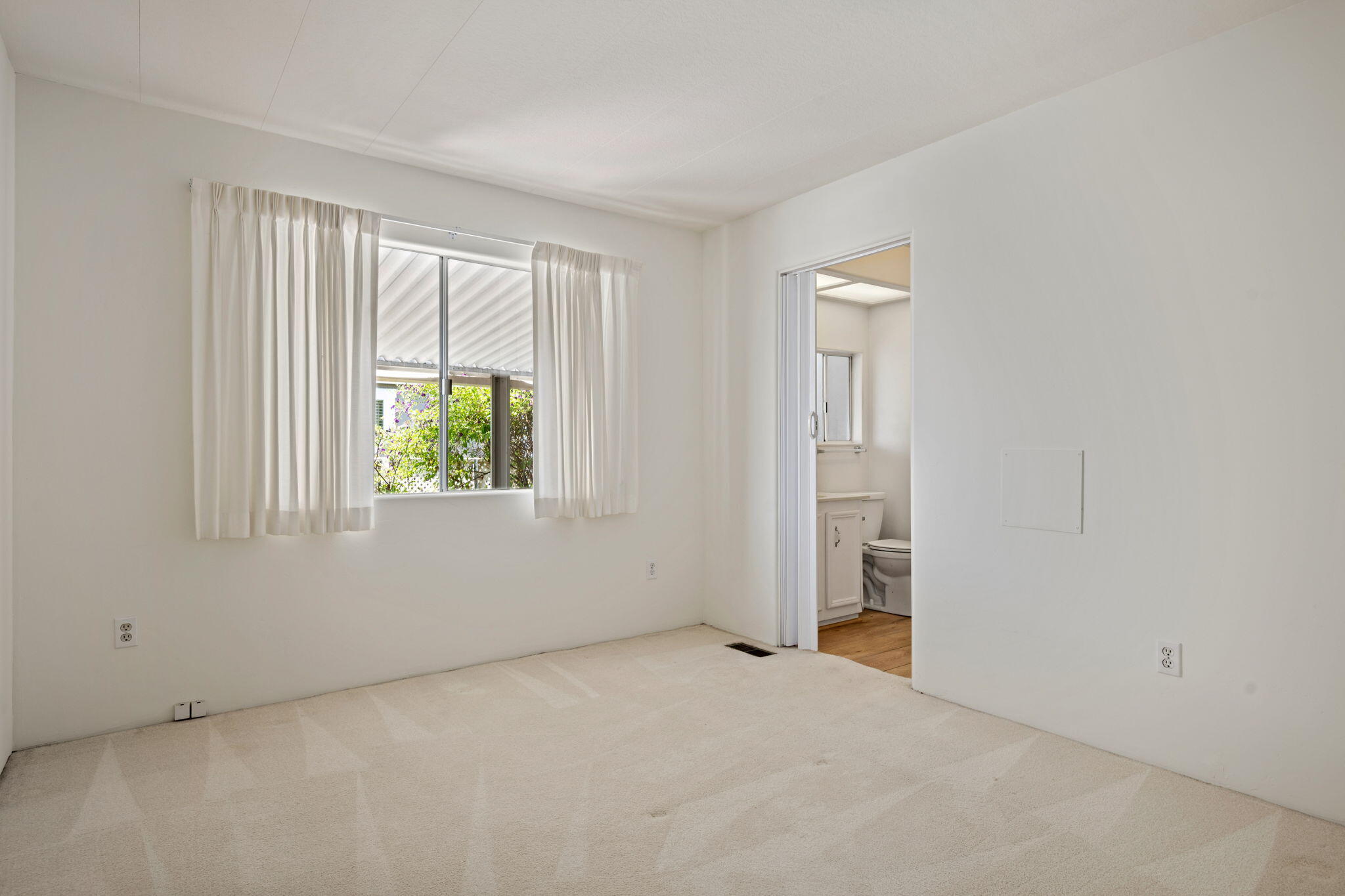 340 Old Mill Road, Unit 107 Santa Barbara, CA 93110 - Photo 17 of 33 an empty room with a window