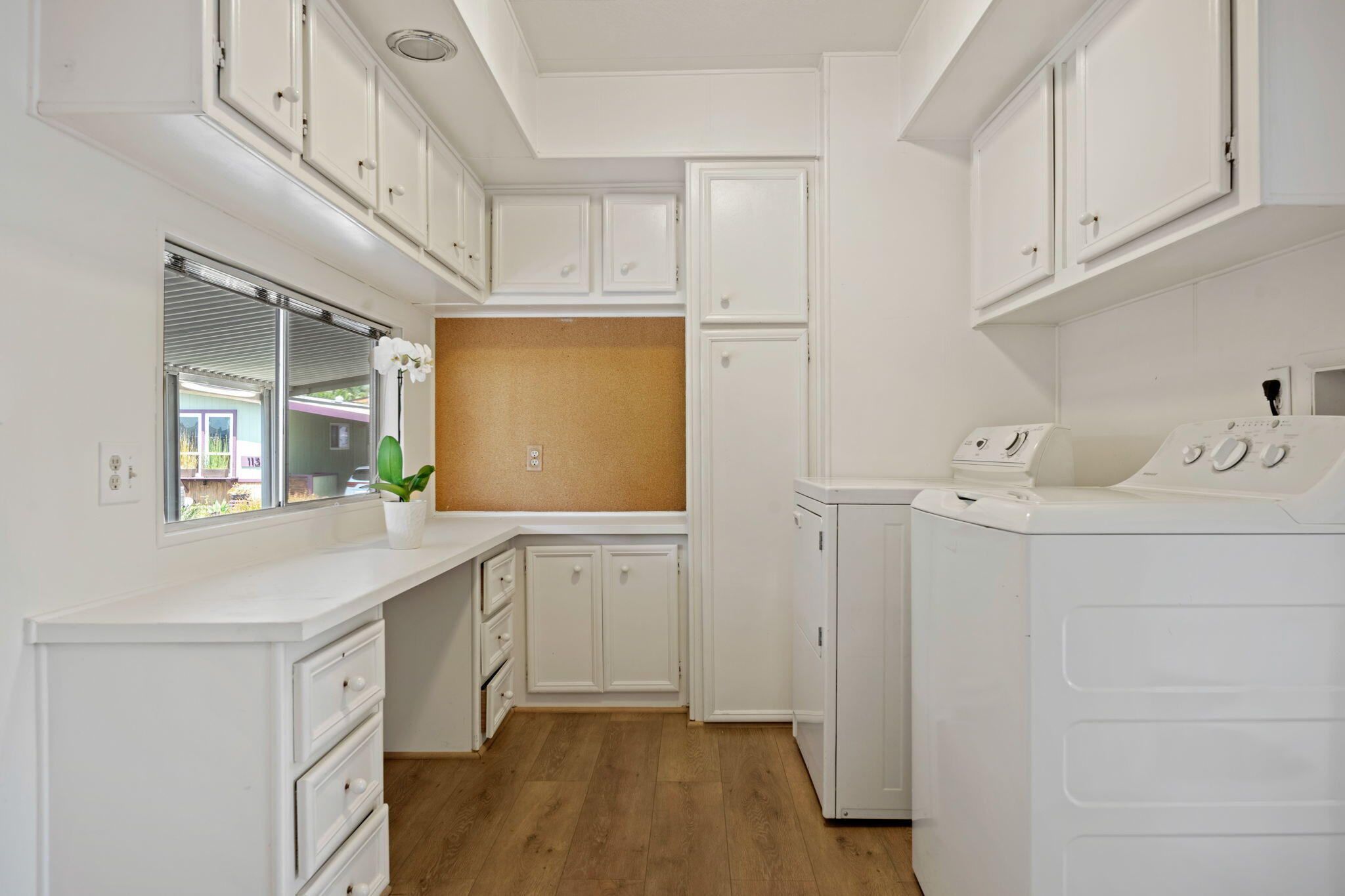 340 Old Mill Road, Unit 107 Santa Barbara, CA 93110 - Photo 22 of 33 a utility room with cabinets washer and dryer