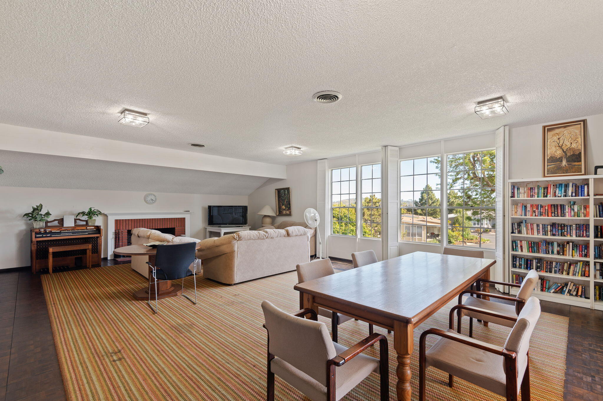 340 Old Mill Road, Unit 107 Santa Barbara, CA 93110 - Photo 32 of 33 a living room with furniture a flat screen tv and a large window