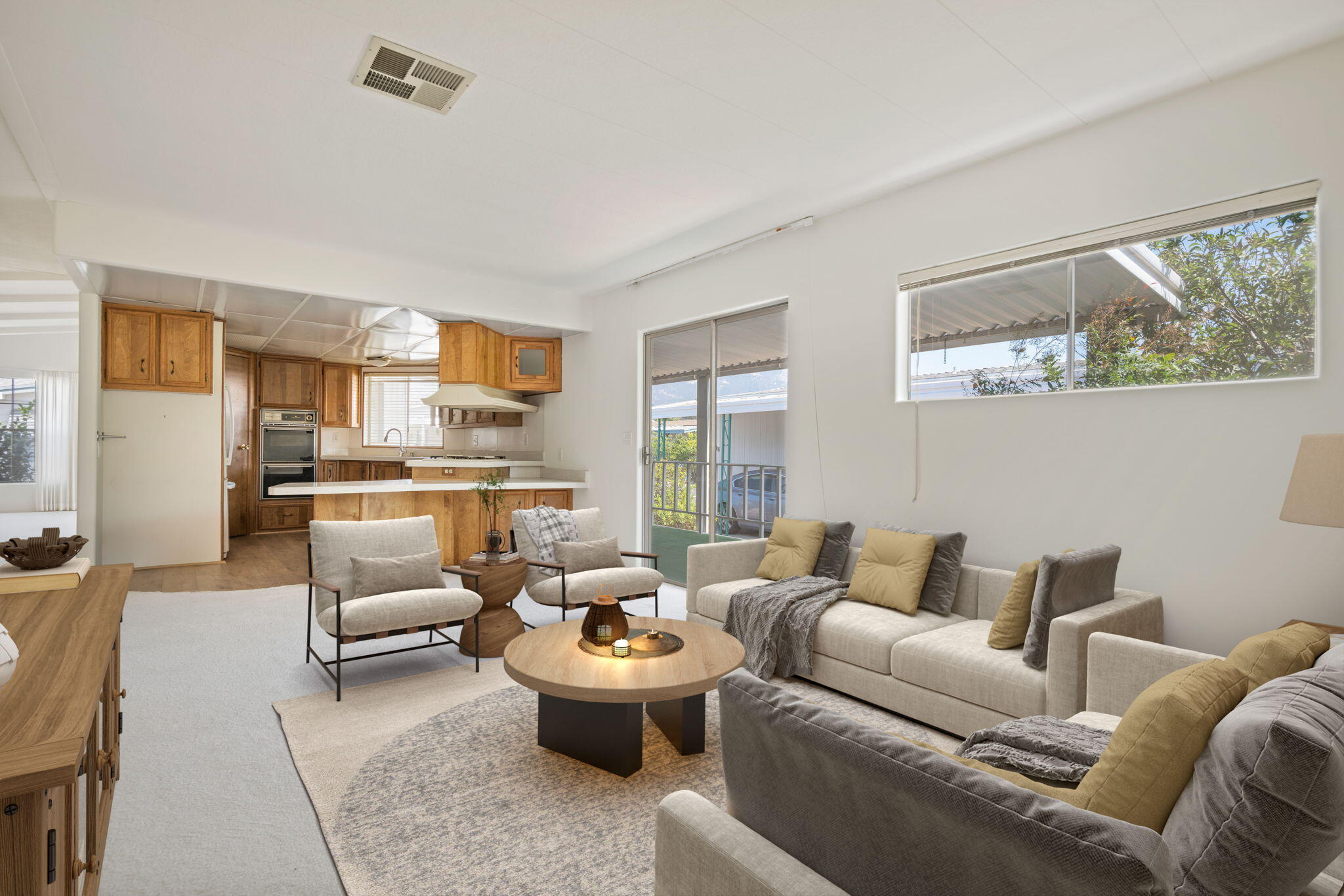 340 Old Mill Road, Unit 107 Santa Barbara, CA 93110 - Photo 9 of 33 a living room with furniture and a large window