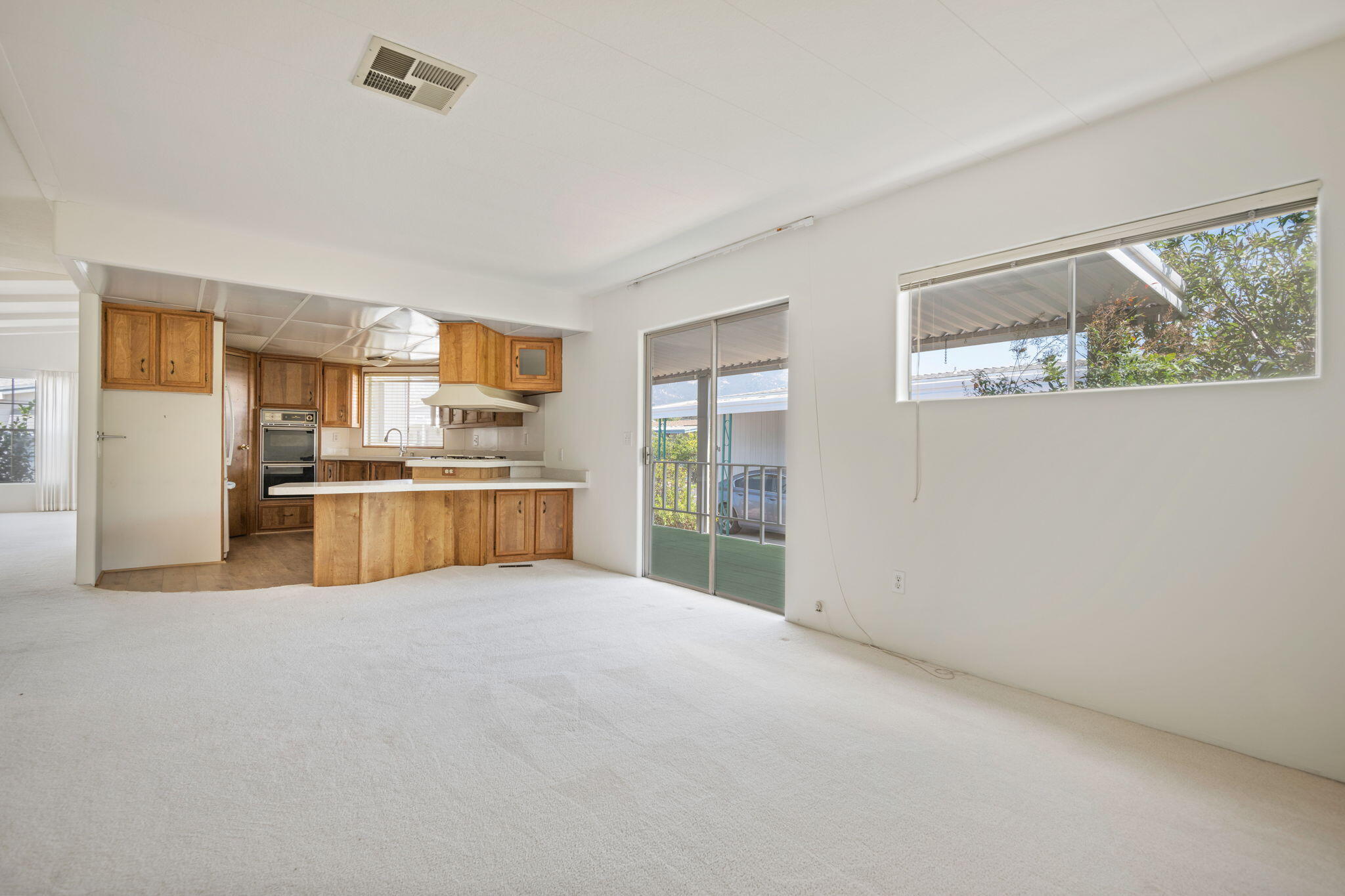 340 Old Mill Road, Unit 107 Santa Barbara, CA 93110 - Photo 10 of 33 a view of kitchen with stainless steel appliances granite countertop a refrigerator and a stove top oven