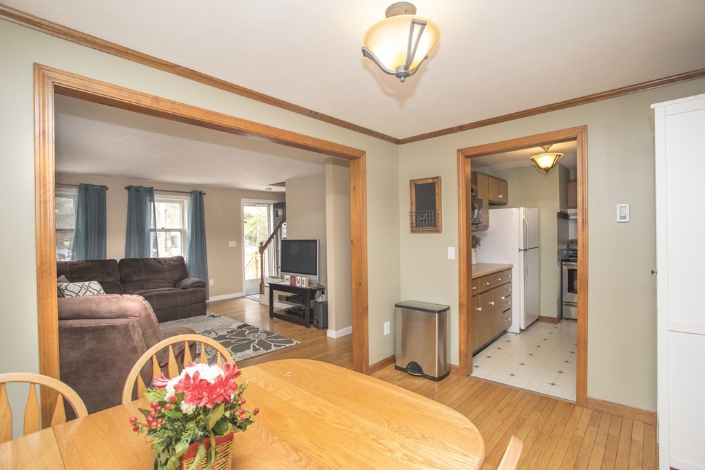648 County Road Wareham, MA 02576 - Photo 13 of 30 a spacious bedroom with a bed dresser and a chandelier