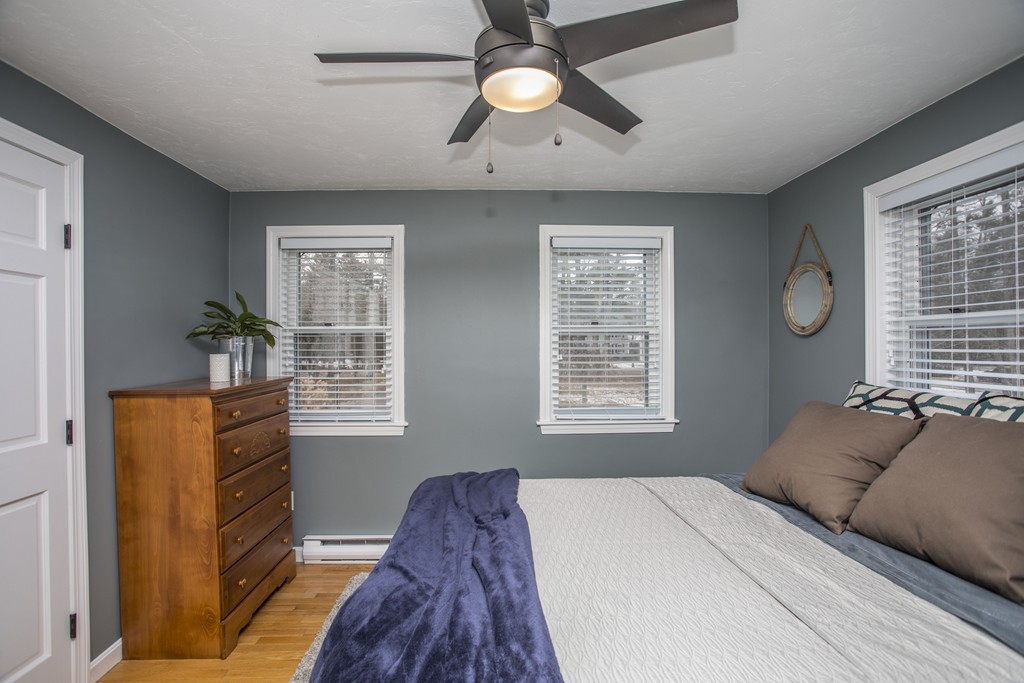 648 County Road Wareham, MA 02576 - Photo 23 of 30 a bedroom with a bed and a chandelier