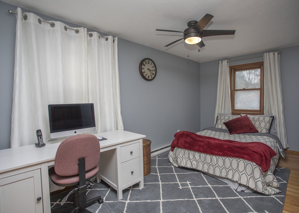 648 County Road Wareham, MA 02576 - Photo 27 of 30 a bedroom with a bed and a chandelier
