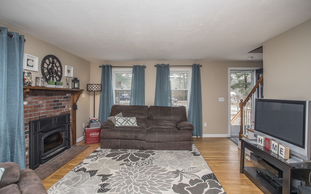 648 County Road Wareham, MA 02576 - Photo 9 of 30 a living room with furniture and a fireplace
