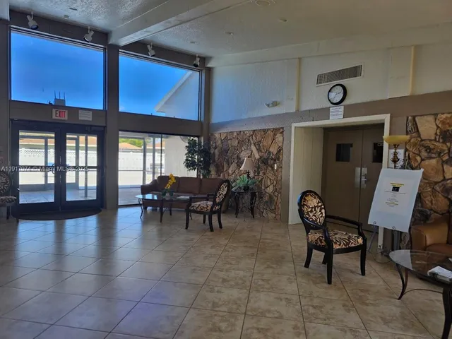 a view of a livingroom with furniture and front door
