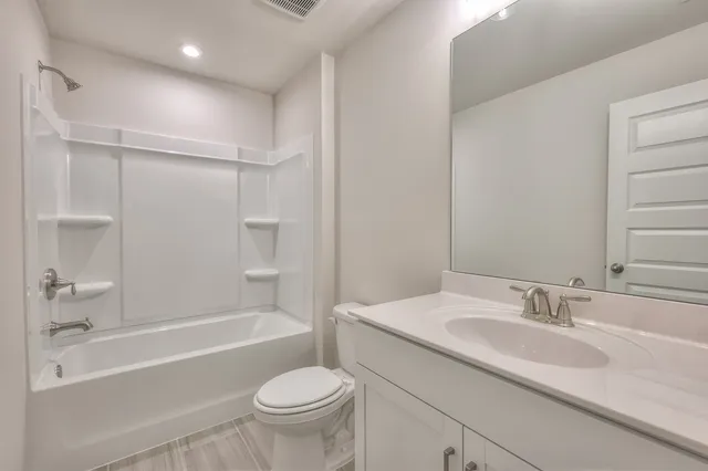 a bathroom with a sink toilet and a bathtub