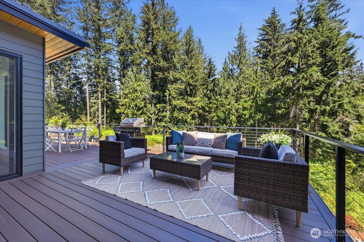 7416 Lake Alice Road Southeast Fall City, WA 98024 - Photo 29 of 40 a outdoor sitting area with furniture and wooden floor