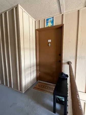 a view of a room with wooden floor and windows