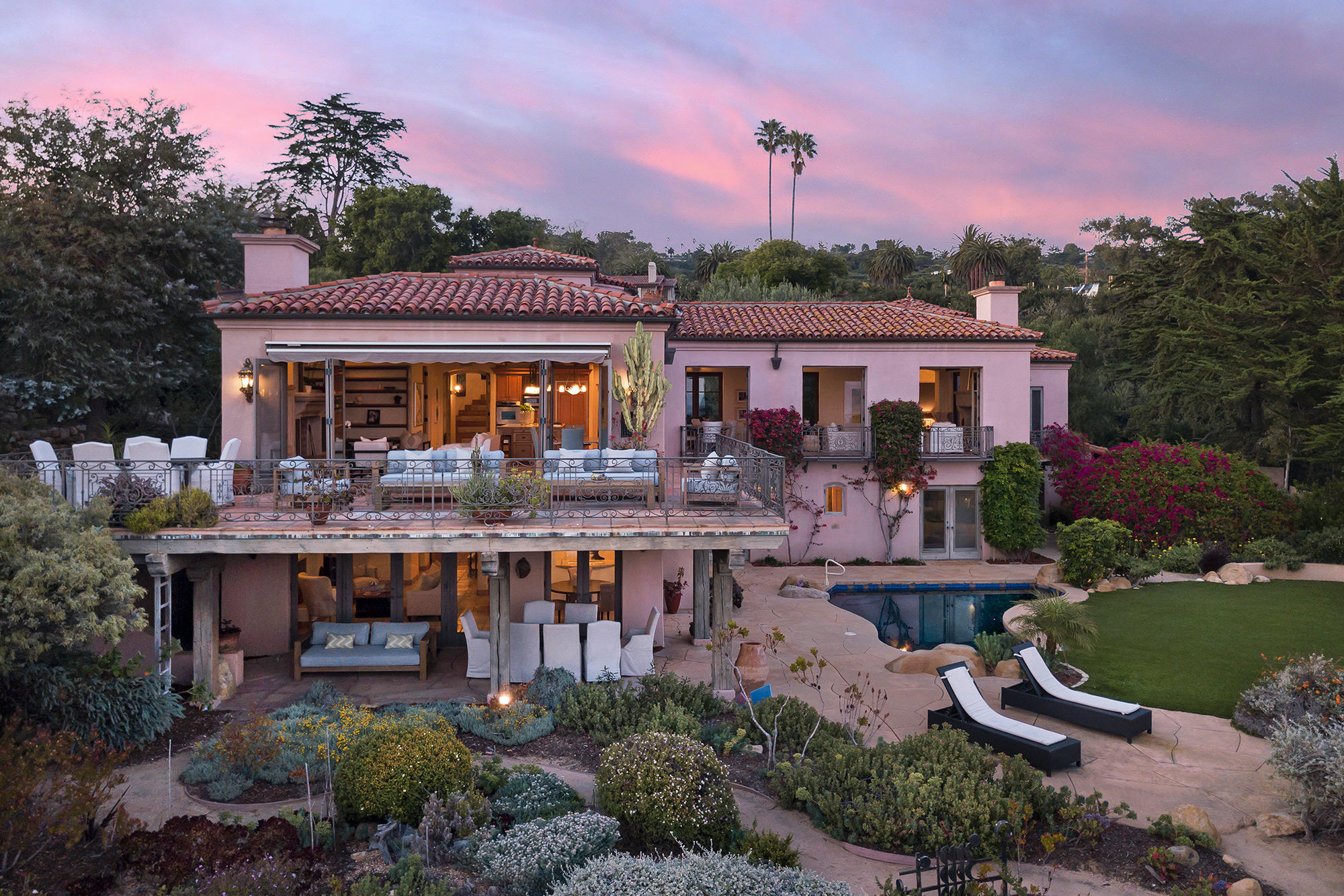4045 Bajada Lane Santa Barbara, CA 93110 - Photo 2 of 32 a front view of a house with garden and trees