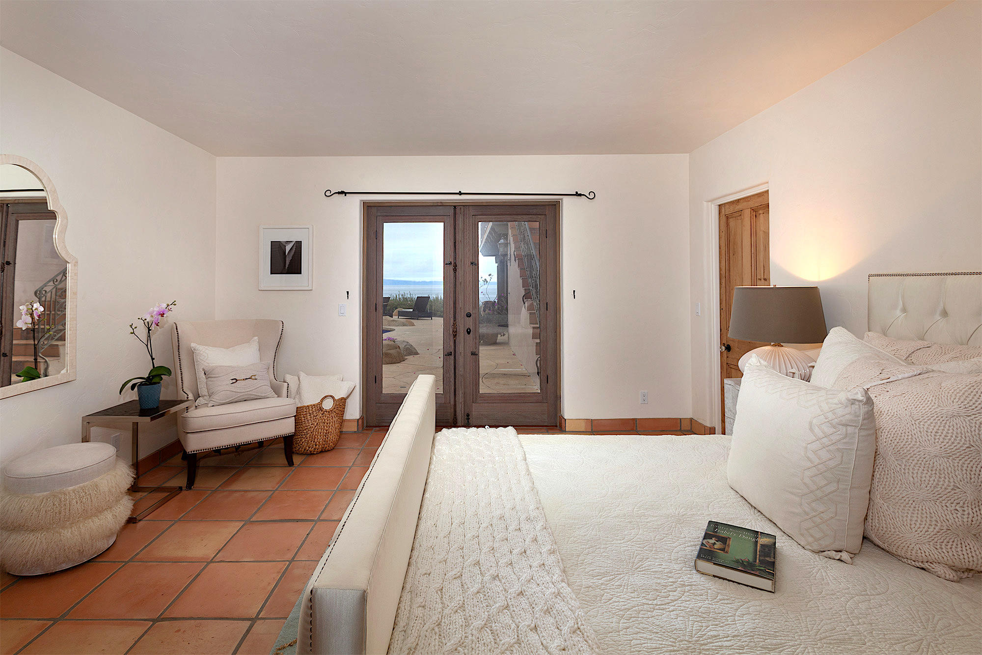 4045 Bajada Lane Santa Barbara, CA 93110 - Photo 22 of 32 a spacious bedroom with a bed and glass door