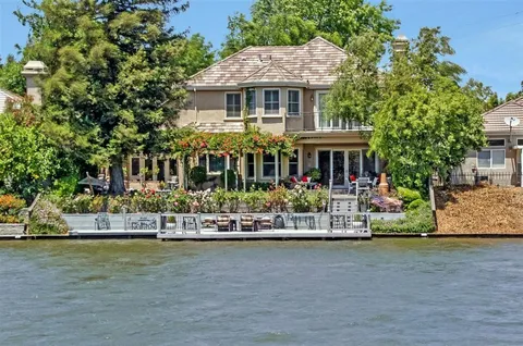 a front view of a house with a ocean view
