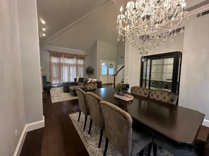 a bedroom with a bed and a chair