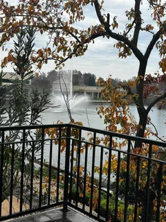 a bathroom with a granite countertop tub sink and mirror