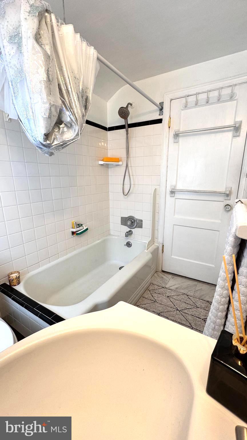 1029 Lamb Road Secane, PA 19018 - Photo 36 of 78 a bathroom with a tub and a shower