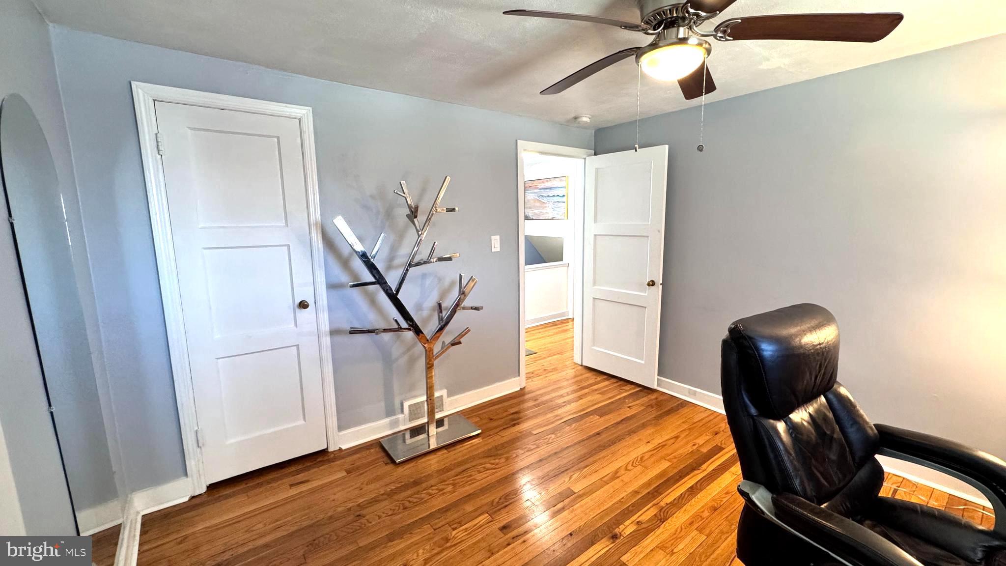 1029 Lamb Road Secane, PA 19018 - Photo 40 of 78 a view of a livingroom with wooden floor and workspace