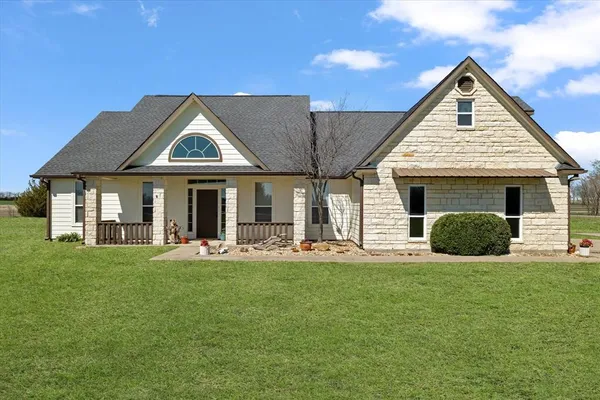 a front view of a house with a yard