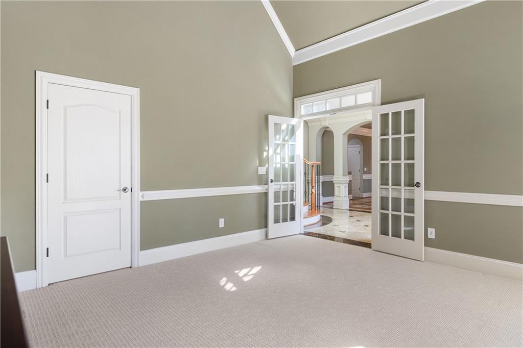 5300 Hill Road Acworth, GA 30101 - Photo 13 of 100 an empty room with windows and entrance