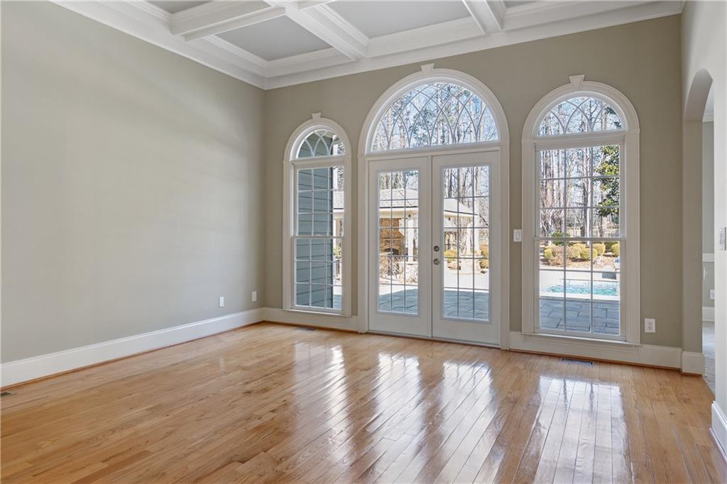 5300 Hill Road Acworth, GA 30101 - Photo 16 of 100 an empty room with wooden floor windows and outdoor view