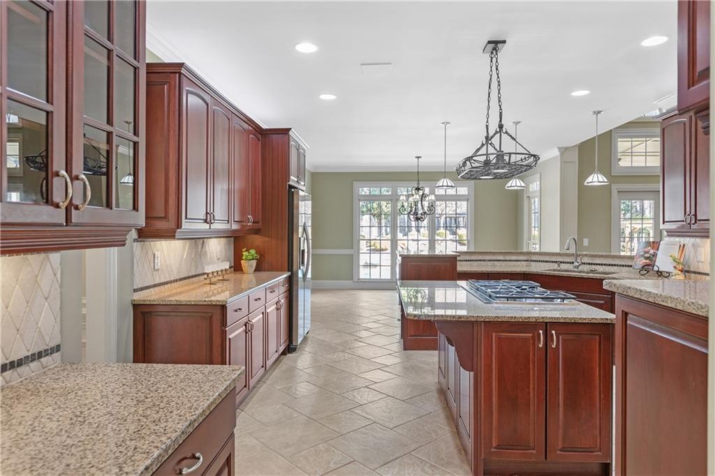 5300 Hill Road Acworth, GA 30101 - Photo 26 of 100 a kitchen with stainless steel appliances granite countertop a stove a sink and a refrigerator