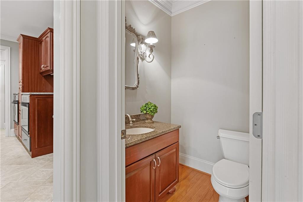 5300 Hill Road Acworth, GA 30101 - Photo 30 of 100 a bathroom with a granite countertop toilet sink and mirror