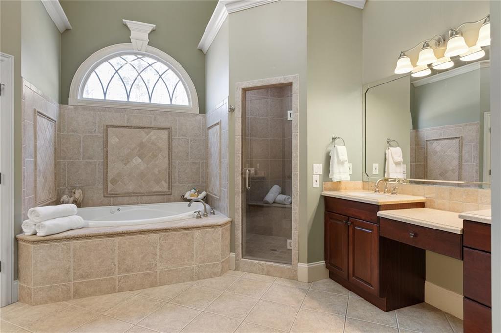 5300 Hill Road Acworth, GA 30101 - Photo 39 of 100 a spacious bathroom with a tub sink and mirror