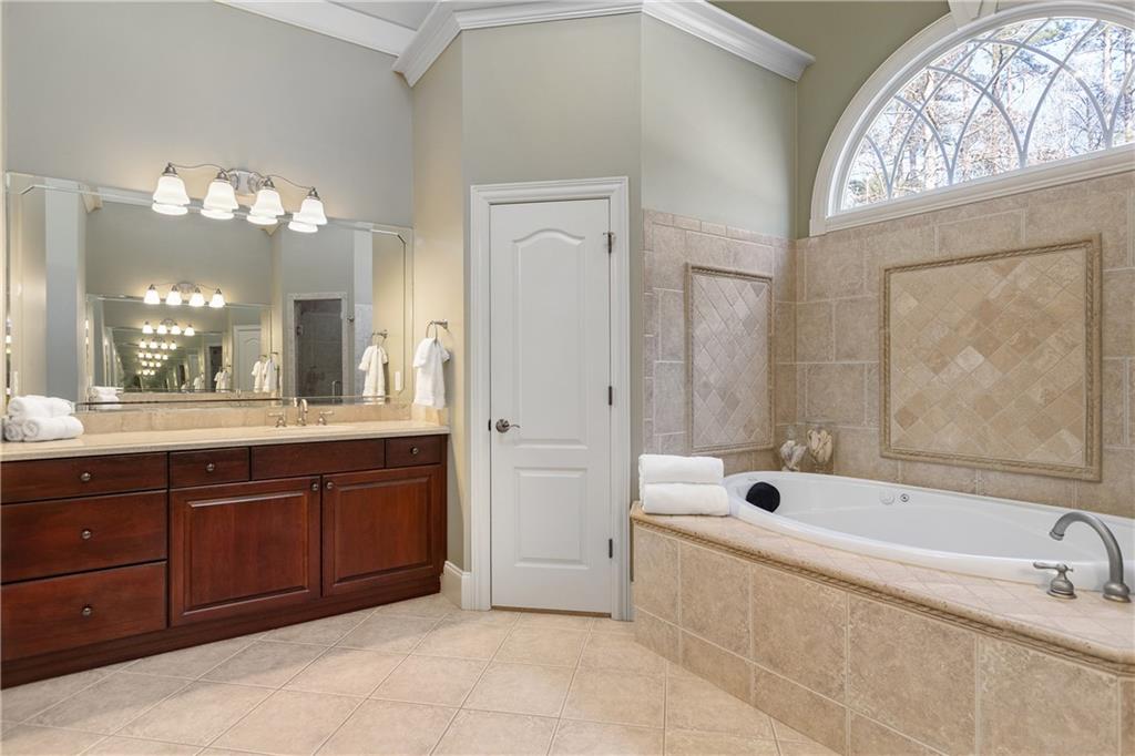 5300 Hill Road Acworth, GA 30101 - Photo 40 of 100 a spacious bathroom with a tub sink and mirror