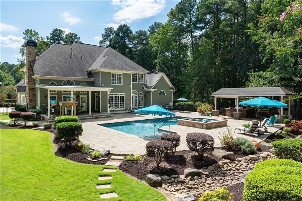 5300 Hill Road Acworth, GA 30101 - Photo 5 of 100 a front view of a house with garden and sitting area