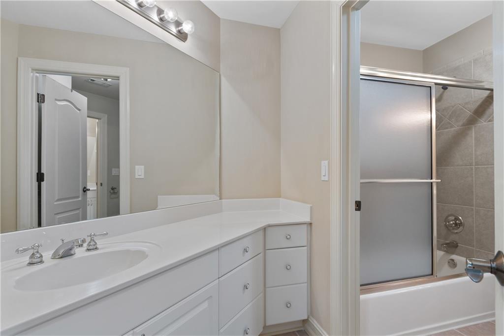 5300 Hill Road Acworth, GA 30101 - Photo 55 of 100 a bathroom with a shower sink vanity and mirror