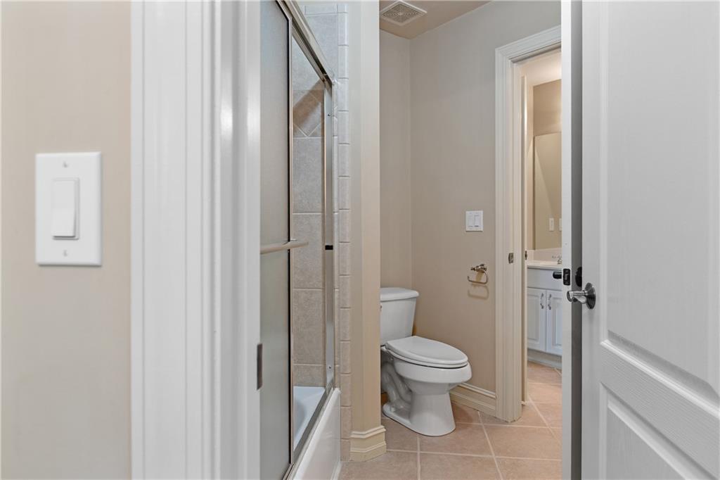 5300 Hill Road Acworth, GA 30101 - Photo 56 of 100 a bathroom with a toilet and a shower