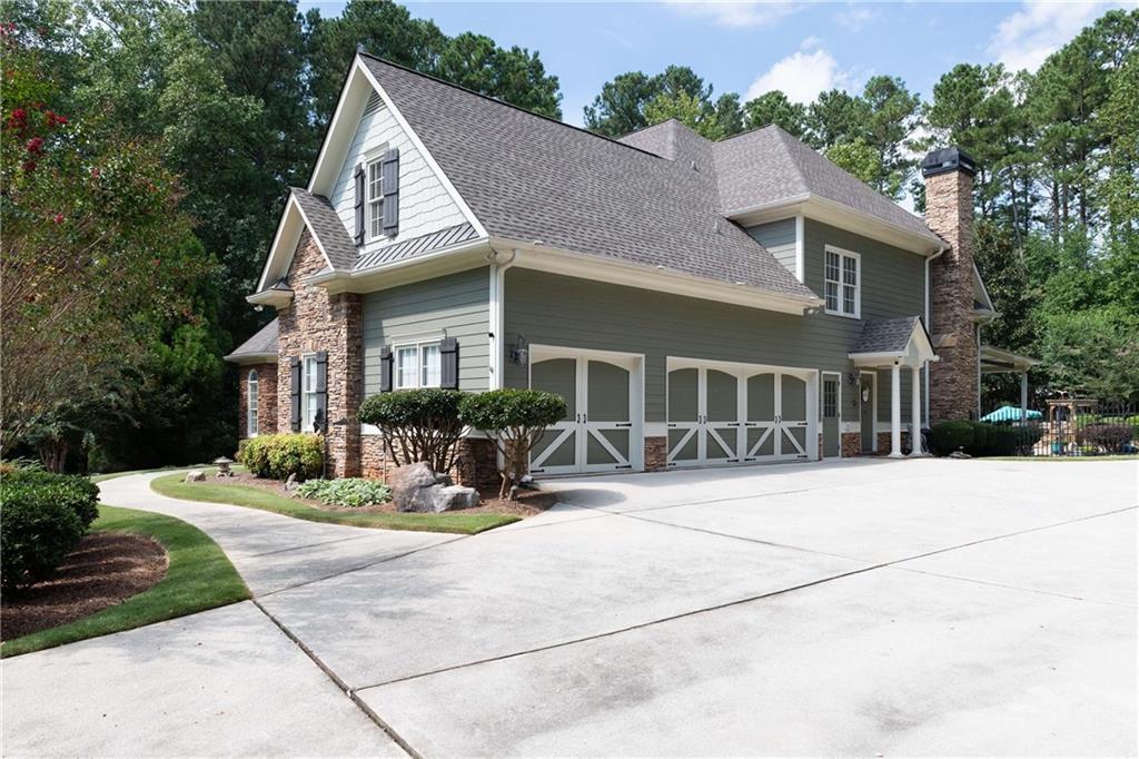 5300 Hill Road Acworth, GA 30101 - Photo 81 of 100 a view of a house with sitting area and garden