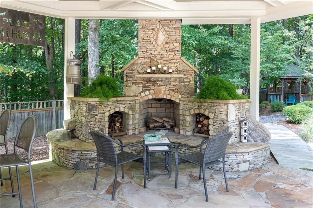 5300 Hill Road Acworth, GA 30101 - Photo 87 of 100 a patio with table and chairs and potted plants