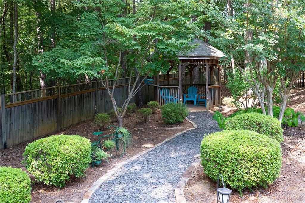 5300 Hill Road Acworth, GA 30101 - Photo 88 of 100 a front view of a house with garden