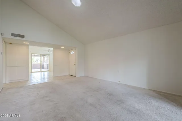 a view of an empty room with a window