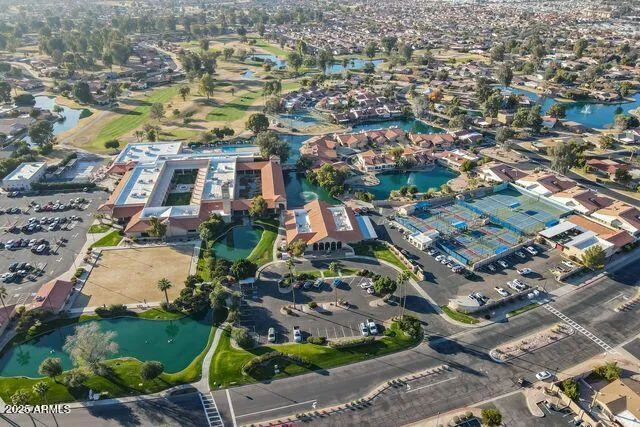 a view of a lake with houses in the back