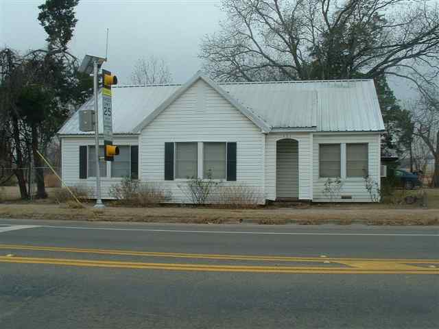 a view of a house with a street