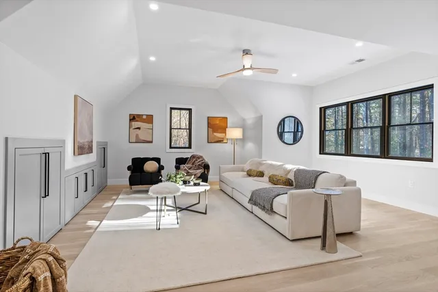 a living room with furniture and windows