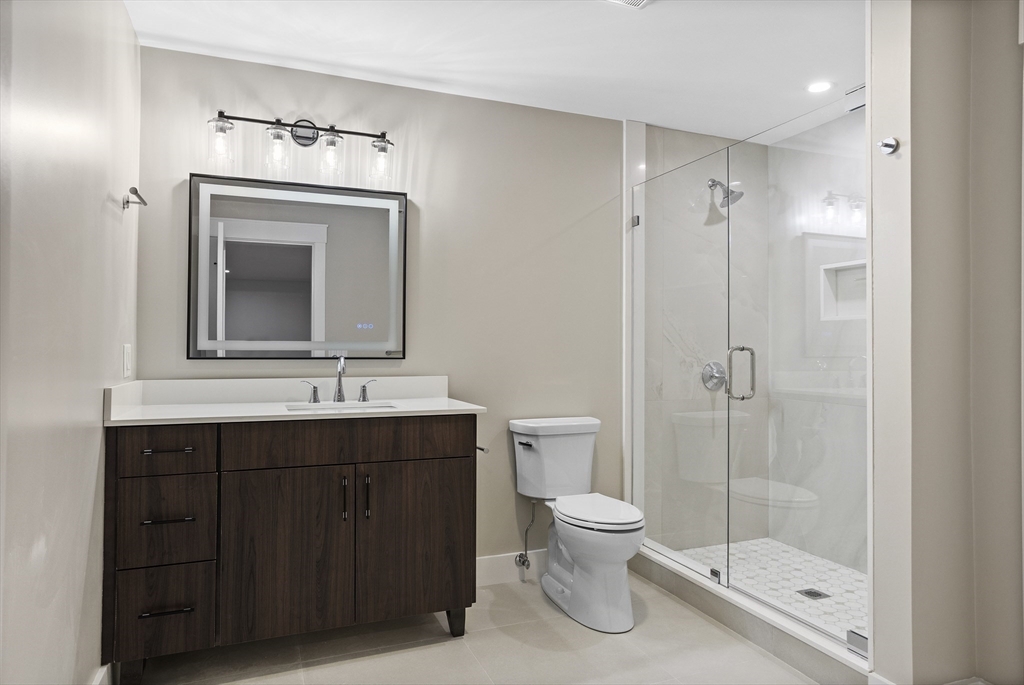 236 Fairhaven Road Concord, MA 01742 - Photo 26 of 35 a bathroom with a toilet sink and mirror