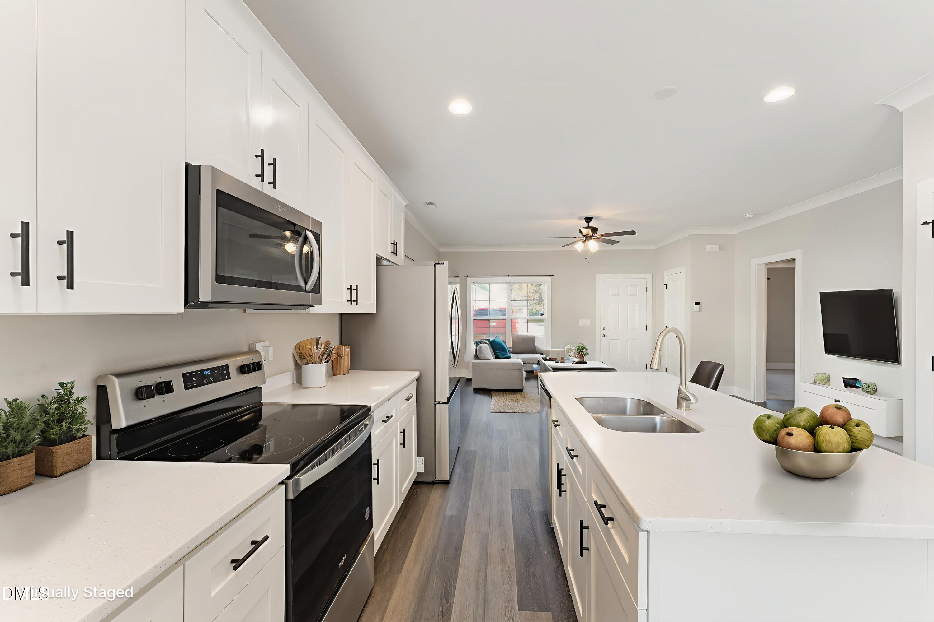 903 West Anderson Street, Unit 1/2 Selma, NC 27576 - Photo 13 of 36 a kitchen with sink a stove and cabinets